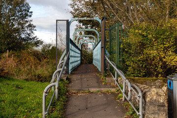 Pedestrian Footbridge Over the River Allan at Bridge of Allan Scotalnd in Autumn