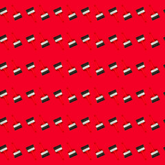 Seamless pattern with large wide new red brush for construction or wall painting or canvas priming on a red background. Christmas wallpaper. Textured banner for a hardware store or art shop. Close-up.