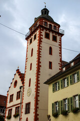 close up of the facade of an old german red-white church tower 