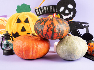 Halloween party ornament with pumpkins and spooky decor on purple