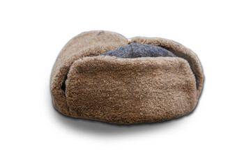 Top-down image of a slightly tilted crescent-shaped object, possibly a cushion or blanket, with brown textured surface and black filling spillage Even lighting indoors under artificial light No add