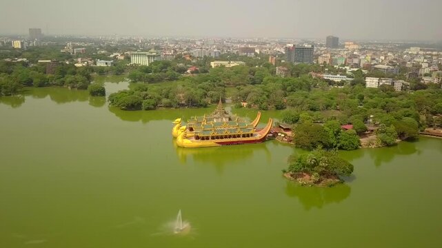  Futuristic aerial view panorama of developing Yangon city , Aerial view of Sule pagoda in downtown, Yangon, Myanmar. Sule Pagoda located in the heart of Yangon, Karaweik royal barge, Kandawgyi Lake, 