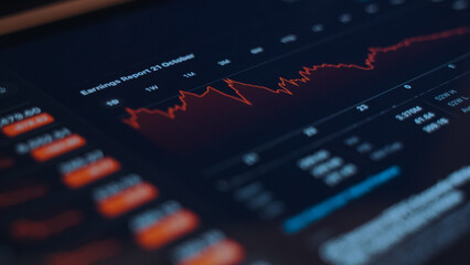 Stock market screen showing price drop graph.