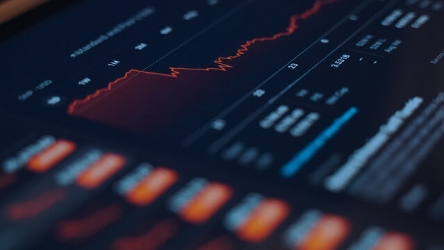 Stock market screen showing price drop graph.