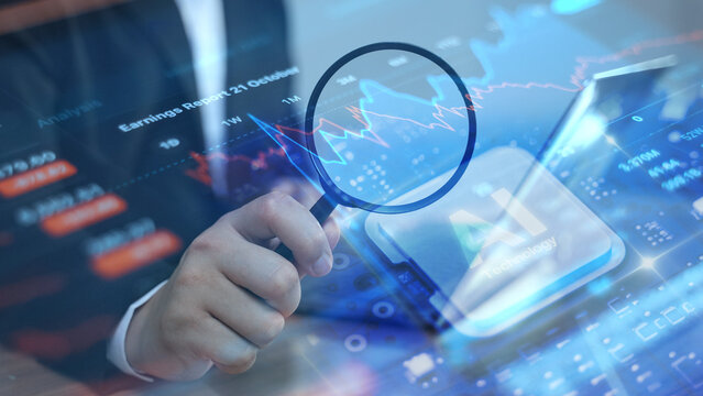 Businessman uses magnifying glass over a tablet displaying financial charts and analytics, symbolizing data analysis and investment research. - Powered by Adobe