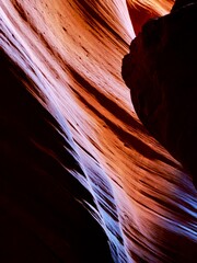 Obraz premium Stunning Natural Sandstone Formation in Antelope Canyon with Vibrant Patterns and Textures in Illuminating Light, Creating a Mesmerizing Abstract Visual Experience