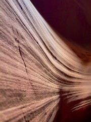 Stunning Abstract View of Natural Sandstone Textures Captured in a Canyon, Emphasizing the Flowing Curves and Warm Earthy Tones for a Serene Visual Experience