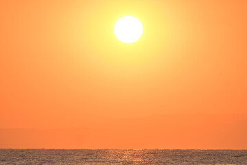 Golden sunrise over the sea in Paralia, Katerini, Greece.