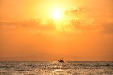 Golden sunrise over the sea in Paralia, Katerini, Greece.