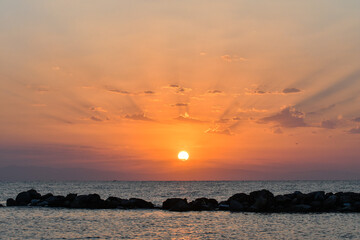 Golden sunrise over the sea in Paralia, Katerini, Greece.