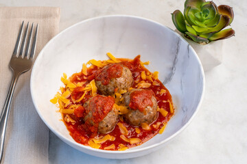 meat balls in sauce and cheese