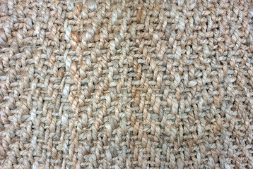 Large weave jute carpet displays intricate texture and natural tones for modern interior design