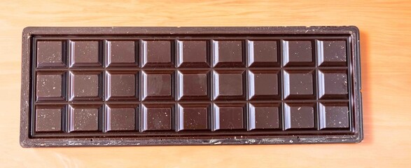 Dark milk chocolate bar in top view