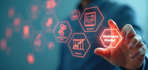 Person interacts with a futuristic digital interface showing business model elements. Icons represent strategy, finance, and planning on a blue background.