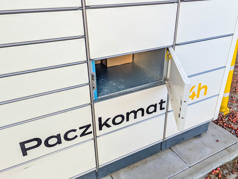 Krakow, Poland, October 20, 2025, Automated parcel locker machine with Paczkomat branding for self-service package pickup and delivery in Krakow Poland. High quality photograph
