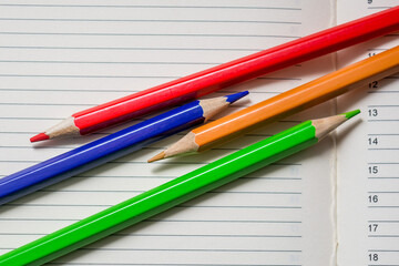 Colored pencils and a notebook