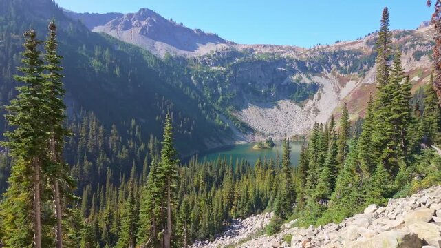 A breathtaking scenic view of the pristine Ann Lake, nestled along the beautiful Maple Pass Trail in the North Cascades