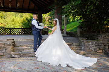 Couple exchanges vows in a scenic outdoor setting on their wedding day