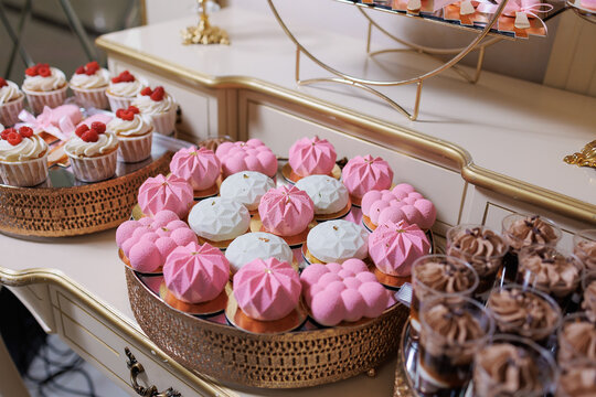 Delicious assortment of colorful desserts on a decorative table at a celebration event