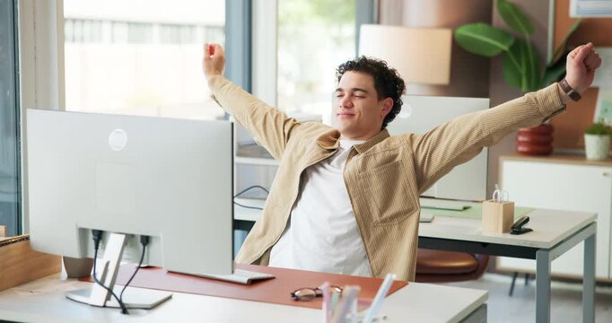 Creative, man and stretching with pc in office for work break, completed task and good news. Person, relax and stress relief with computer for productivity, finish project and employee satisfaction