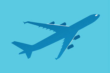 Silhouette of a plane flying in the blue sky above