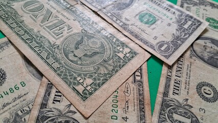 Dollar bills on a green background