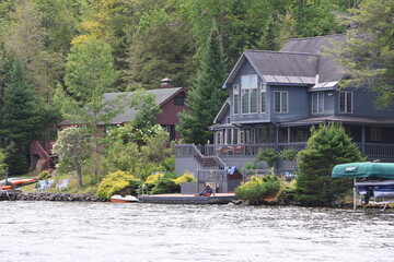 Beautiful summer homes sitting on the shoreline of Canada Lake in the Adirondacks.