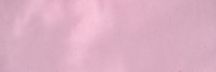 Minimalistic light pink textured background with subtle patterns for creative design projects.