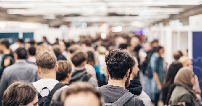 Abstract blurred people at exhibition hall of expo event trade show. Business convention show or job fair. Business concept background.