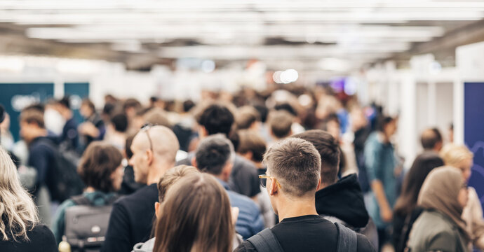 Abstract blurred people at exhibition hall of expo event trade show. Business convention show or job fair. Business concept background.