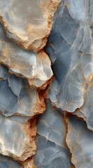 Unique geological formations highlighting intricate textures of blue and beige stones found in a natural rock bed