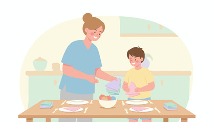 Happy mother and son setting table in kitchen teaching chores and family cooperation