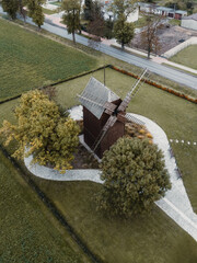 A bird's eye view of the historic, wooden Koźlak "Franciszek" windmill in Pęp&oacute;w, Wielkopolska, from above, autumn surroundings