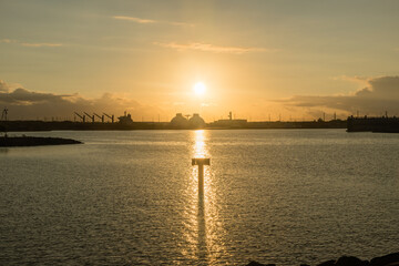 Sun rising over the oil refinery on west Oahu, Hawaii 
