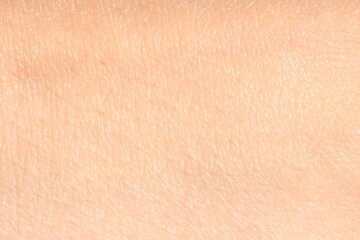 Fototapeta premium Human skin, closeup view. Detailed texture of surface