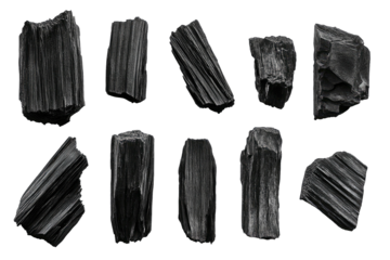 Ten pieces of charcoal artfully arranged on a black background