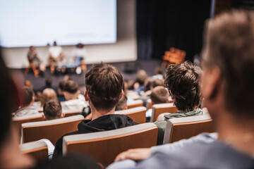Interview and round table discussion at business convention and presentation. Audience at the conference hall. Business and entrepreneurship symposium.