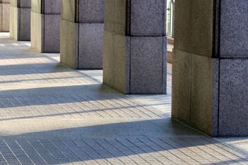 Shadow of multiple pillars reflected on the ground
