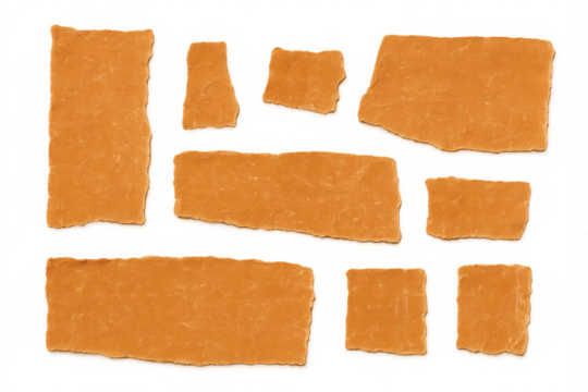 Orange torn paper fragments with rough, natural edges. A versatile vintage paper texture element with transparent background