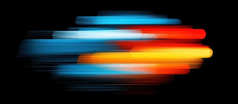 Abstract colorful light streaks on black background.