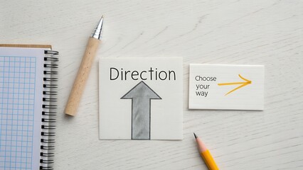 Paper arrow pointing upward to symbolize direction and choice
