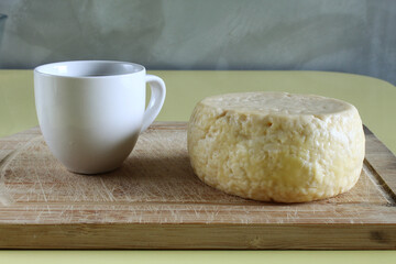 Brazilian breakfast with cup of coffee and traditional canastra cheese.