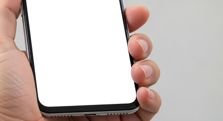 A closeup of a hand holding a smartphone with a blank white screen, showcasing its sleek design against a neutral background, ready for customization