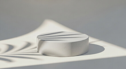 Minimalistic white podium isolated on white background, bathed in soft sunlight and delicate leaf shadows, creating a serene and elegant presentation stage