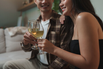 Couple celebrating special moment with wine glasses