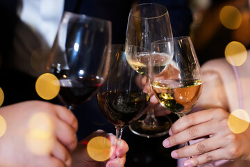 Wine glasses clinked as people celebrated the New Year and New Year's Eve parties.