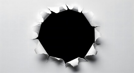 Paper tear, hole in white paper with black background