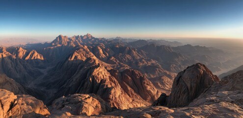 Panoramic view of a mountain range at sunrise