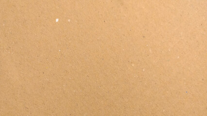 Background of brown kraft paper or cardboard texture. Abstract pattern of beige rough carton, old paper sheet, 