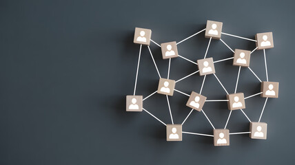 Connected team members network shown with wooden blocks forming strong business relationships online